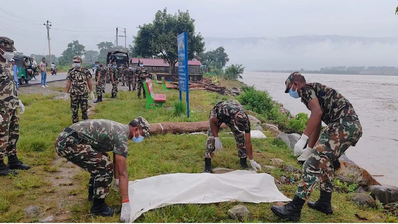 Nepal Flood Bodies: Unclaimed bodies found in Nepal floods to be identified... Video-photography and geo-tagging of every grave.